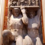 Pantheon sculpture lifting men